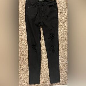 Black target ripped skinny jeans